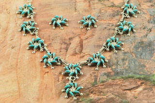 Stunning Necklace and Post Earrings featuring Genuine Sleeping Beauty Turquoise set in Sterling Silver. Beautiful Petit Point Design. Many days of painstaking work went into creating this Southwestern Art Masterpiece. Created by Master Zuni Artists Octavious and Irma Seowtewa. Signed by the artists. The Zuni Pueblo is located in New Mexico, Land of Enchantment.